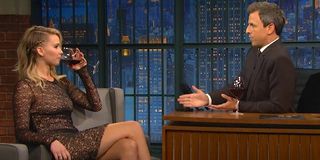 Jennifer Lawrence drinking red wine on Late Night with Seth Meyers