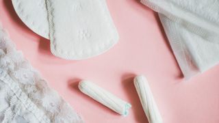 Period products on a pink background