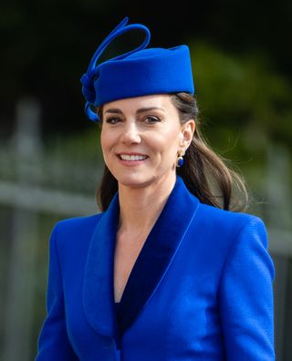 Kate Middleton wearing a cobalt blue coat and matching hat on Easter Sunday 2023