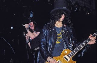 Axl Rose (left) and Slash of Guns N' Roses perform at The Limelight on January 31, 1988 in New York City