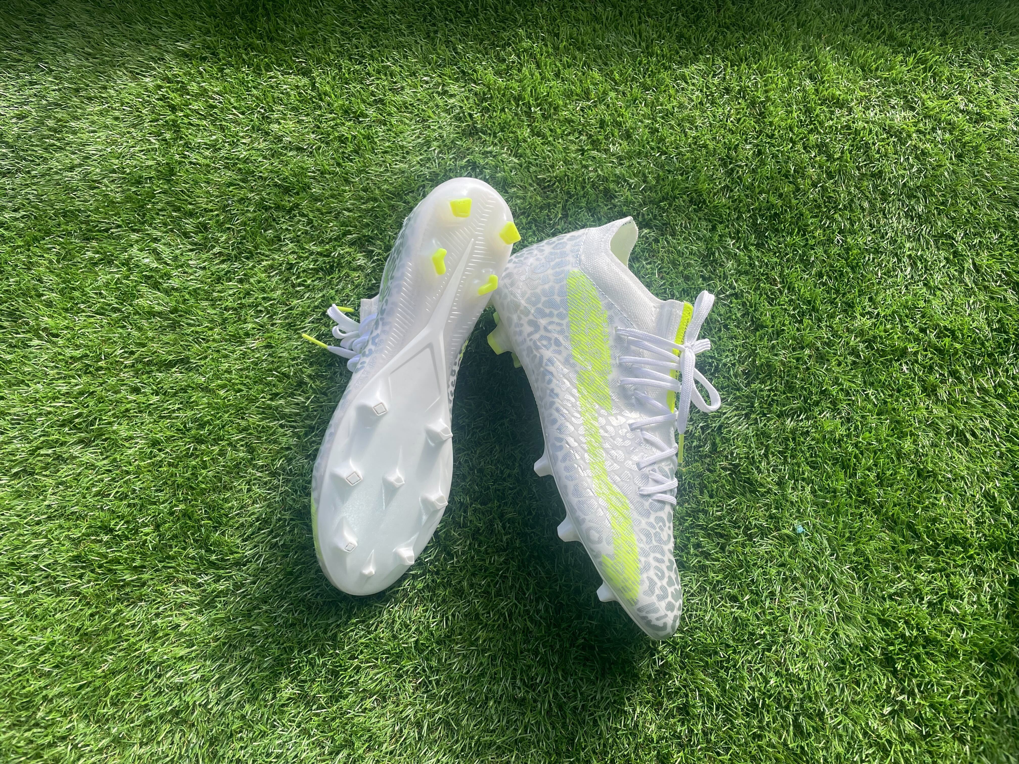 Kipsta CLR Elite football boots made by Decathlon. Placed onto astroturf for a clear look at them.