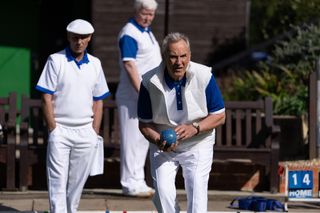 Larry Lamb in character playing lawn bowls in Whitstable Pearl.