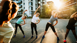 A group of women stretching during workout session