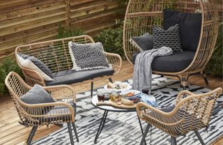 A rattan-effect garden egg chair and matching outdoor furniture from B&Q