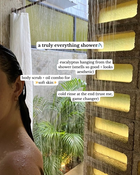 A woman in the shower, with information about 'a truly everything shower' 