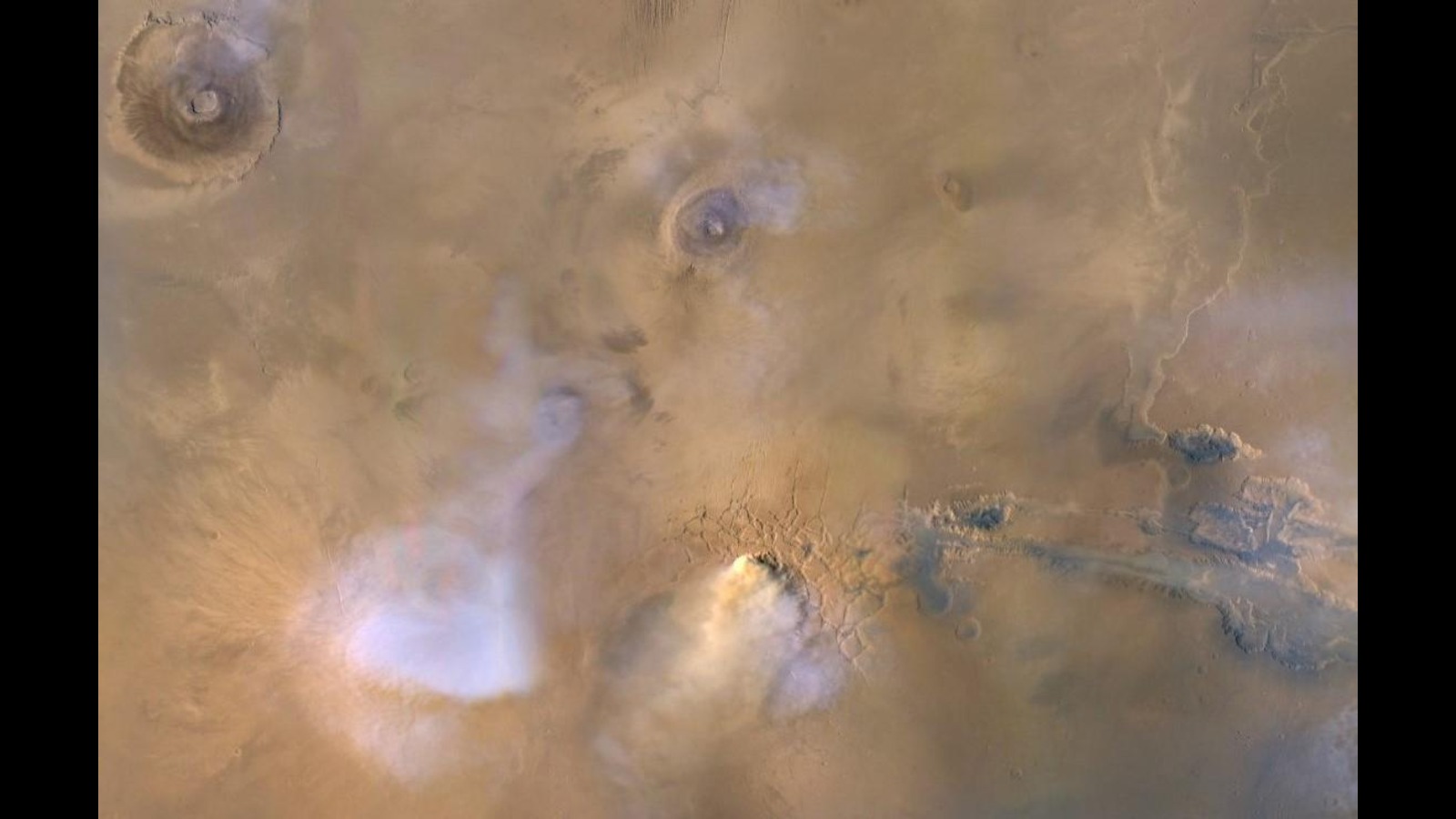 A series of white clouds over a dusty brown background