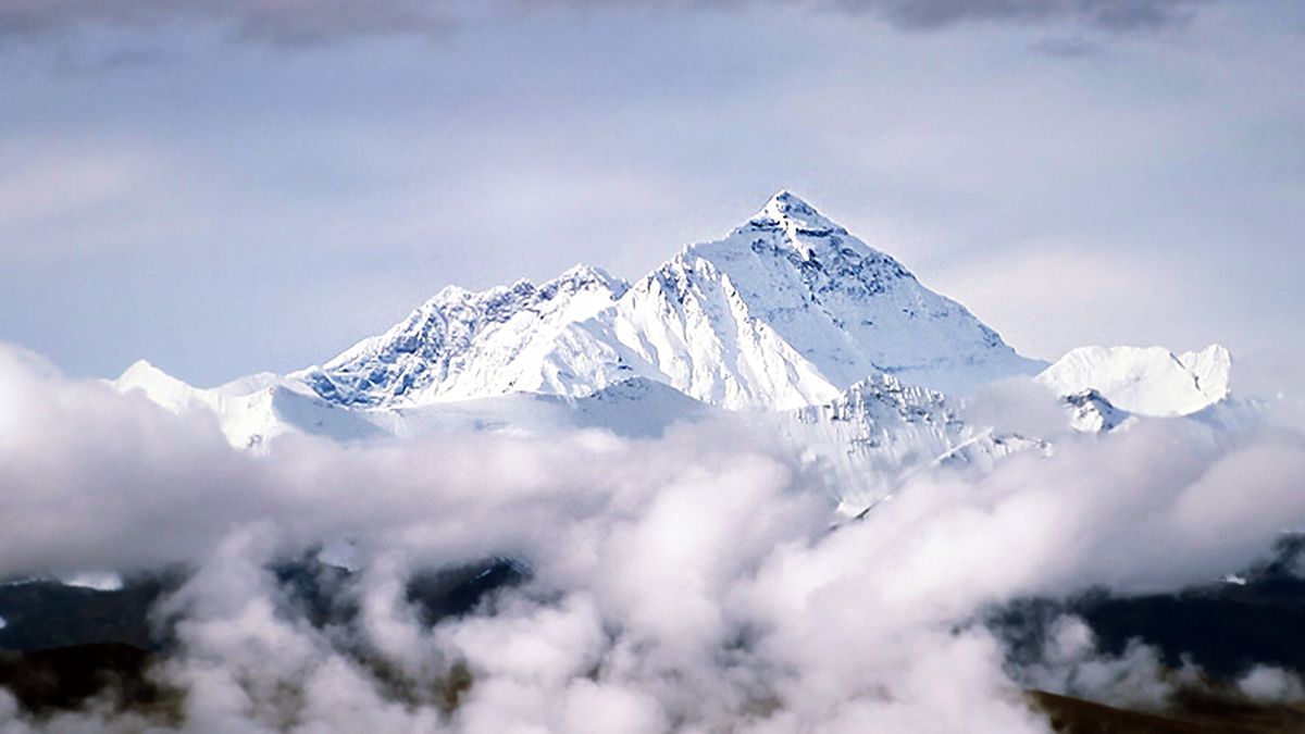 Peak of Mount Everest above the clouds.