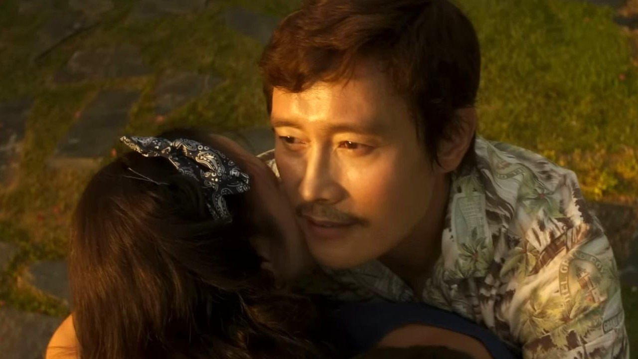 Lee Byung-hun hugging Son Ye-jin in No Other Choice.