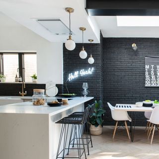 kitchen with neon lights and white worktop