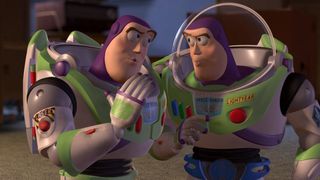 Buzz Lightyear stands beside another one like him in Toy Story 2