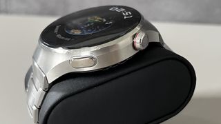 The Huawei Watch 4 Pro on a grey background