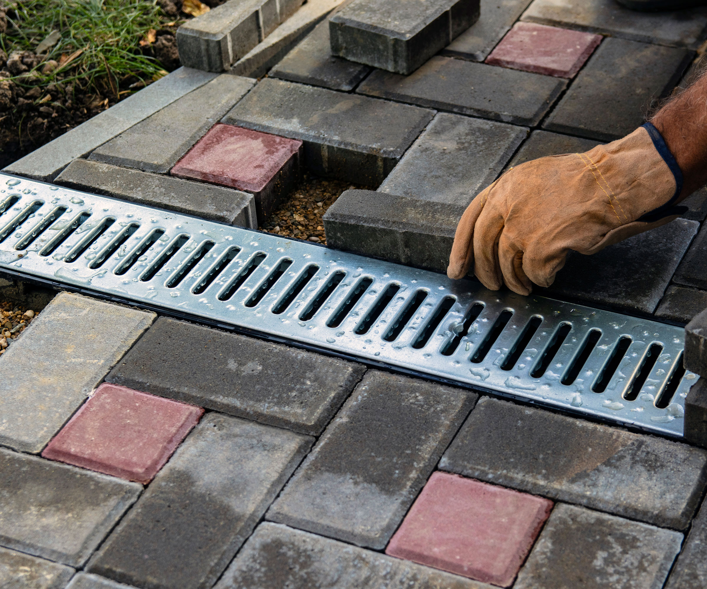 channel drain being fitted in patio design