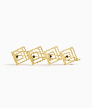 Gold art deco style gold hair clip with black spinels, by Khaite and Elhanati