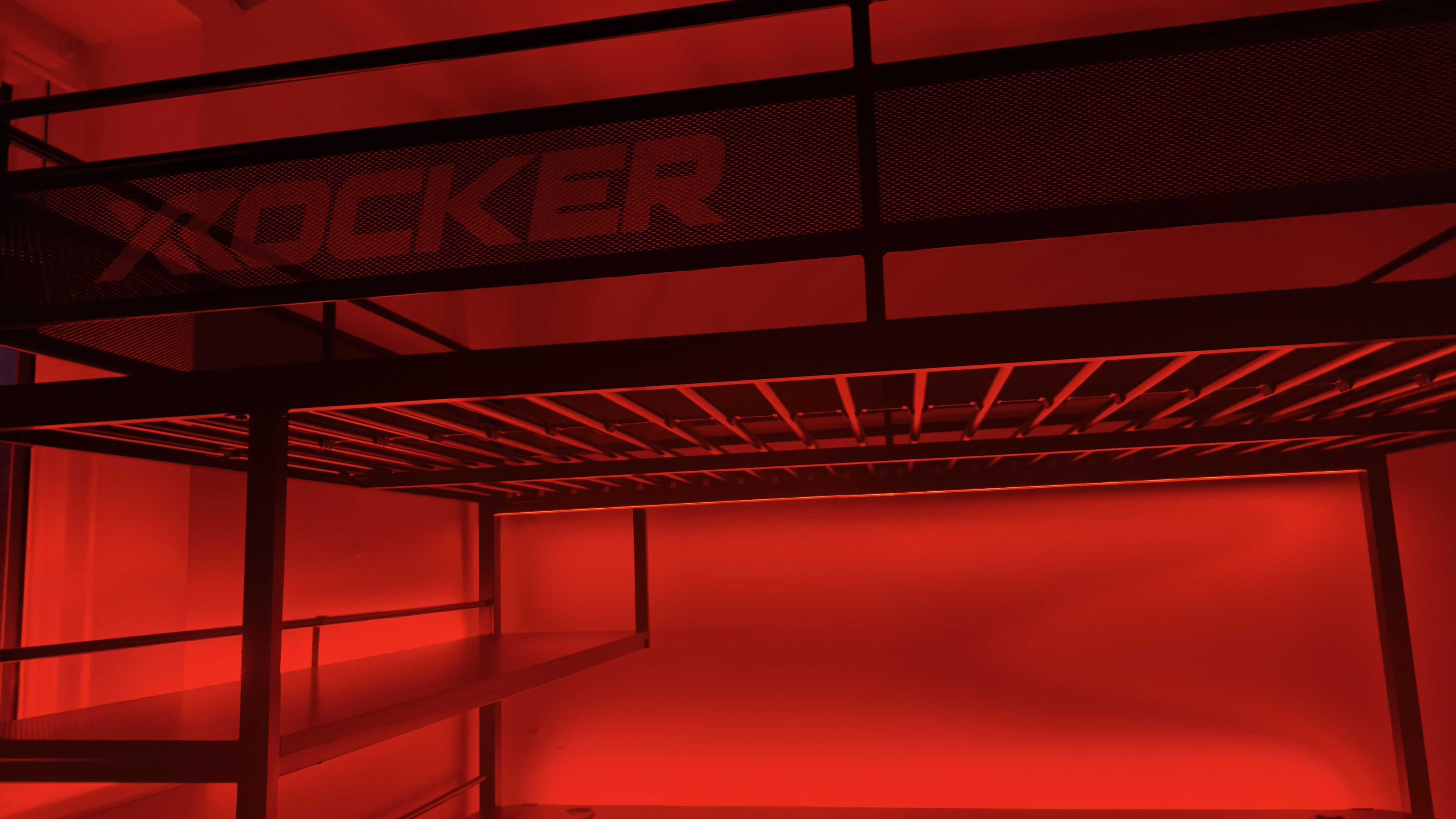 An assembled XRocker Battlebunk XL bed and desk combo inside a small bedroom