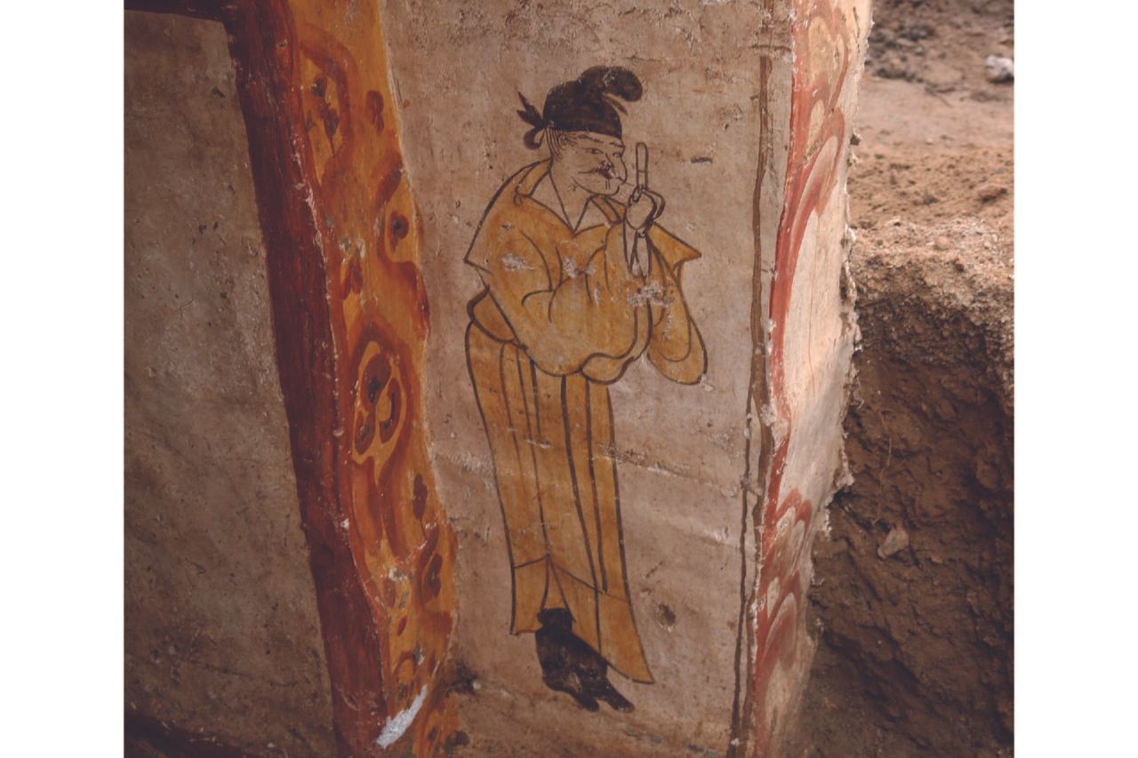 A mural showing a man near the edge of the wall