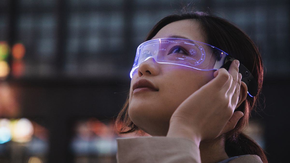 A woman wearing smart glasses looking up