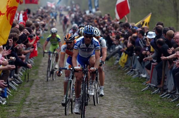 Tom Boonen leads the peloton through the Forest of Arenberg in 2009