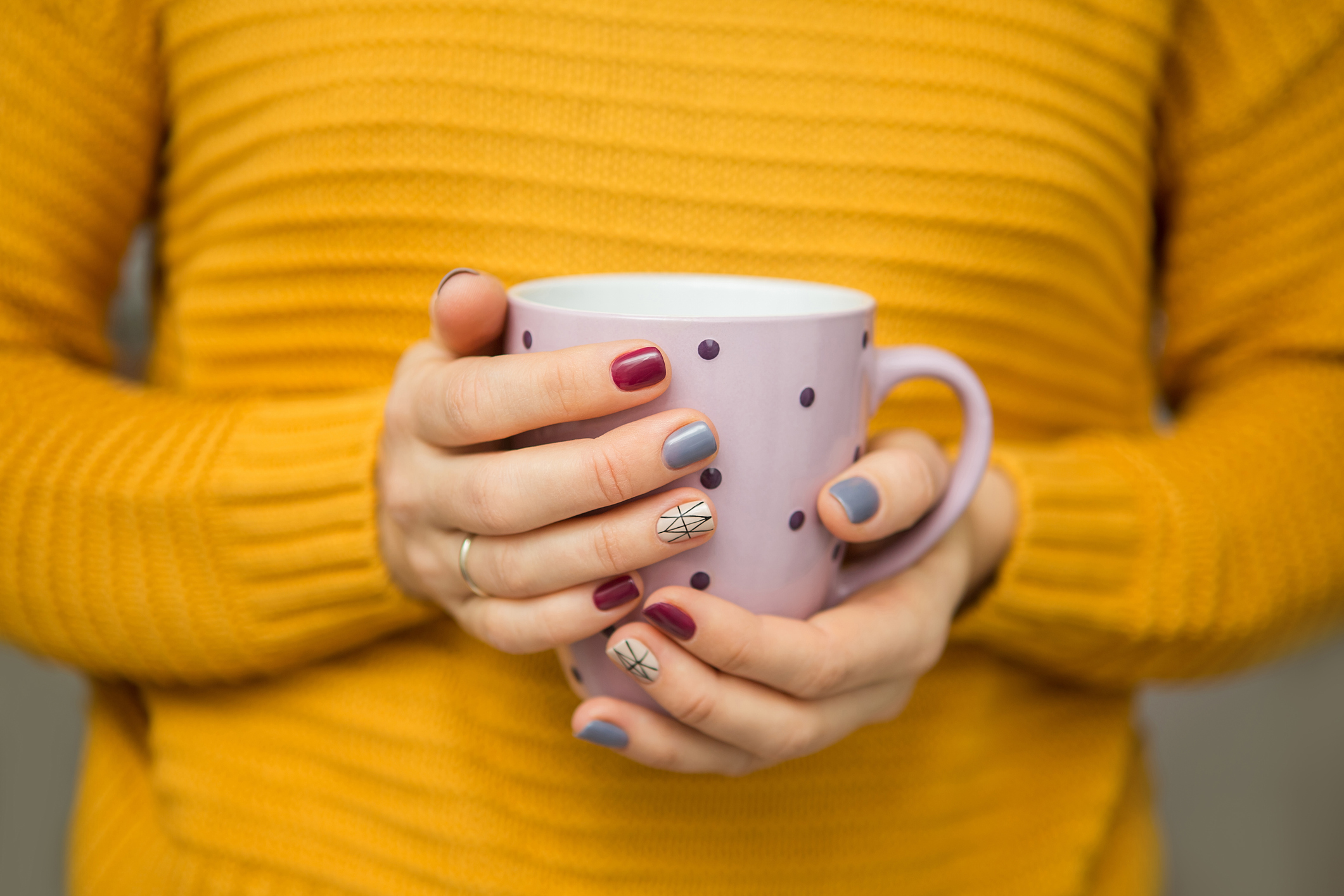 Avoid Black Friday burnout: Female hands hands holding cup of tea