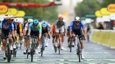 Riders crossing the finish line of the Tour de France in Paris