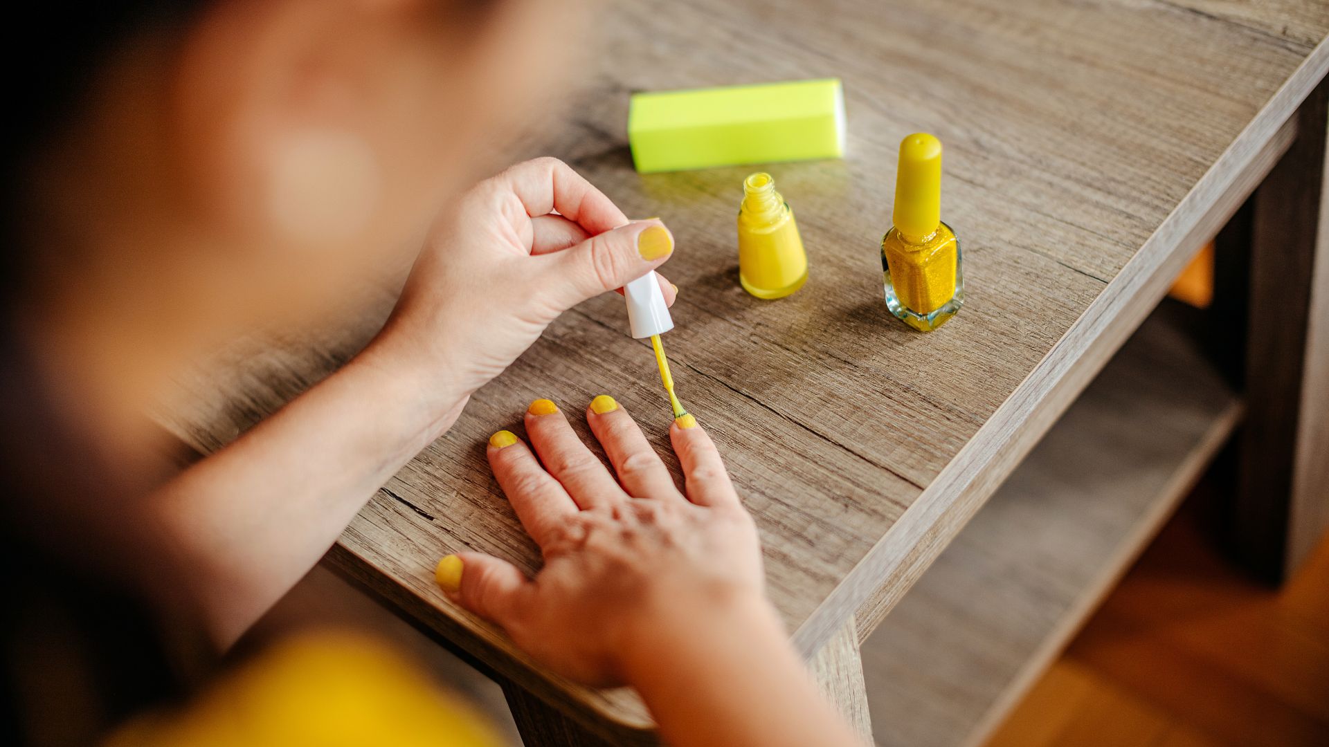 Woman painting her nails