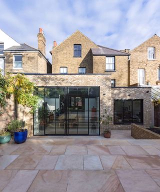 rear brick extension with large crittal style doors and a second extension area set back from main one