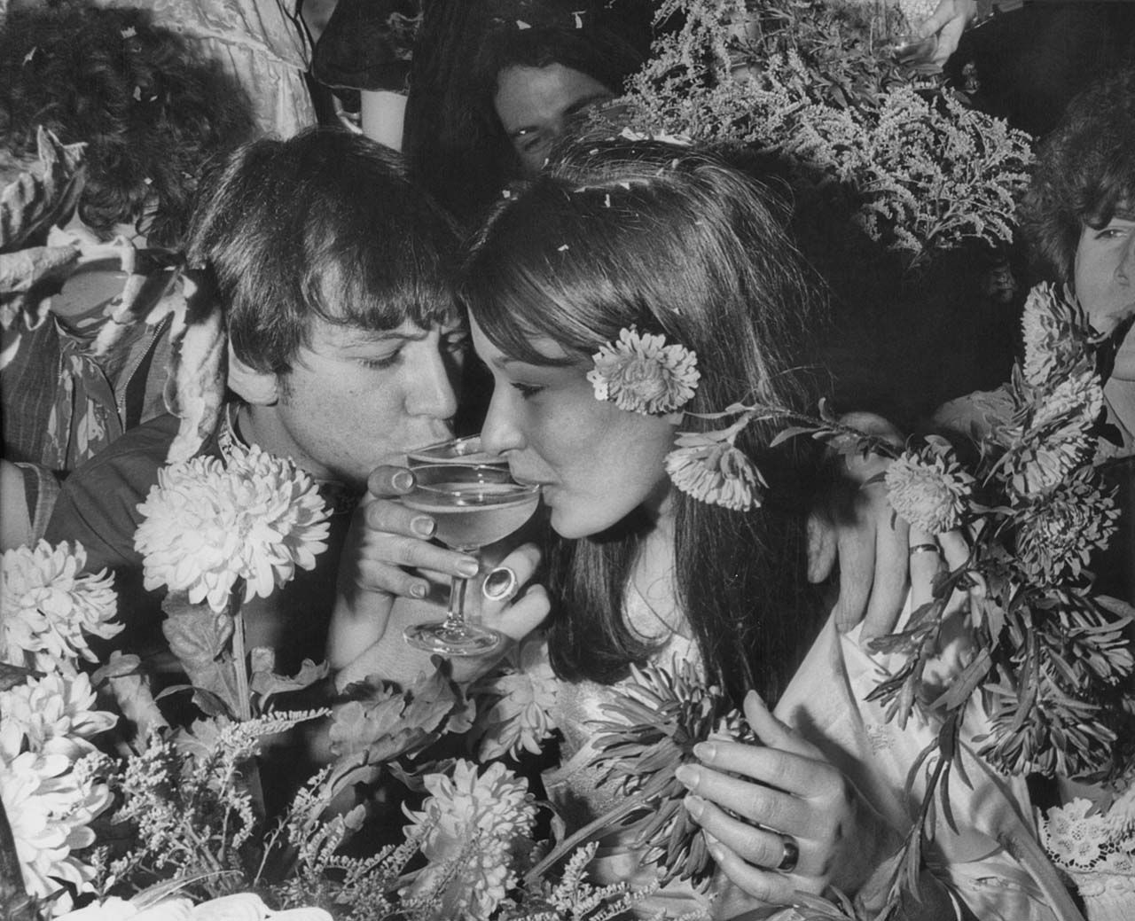 Animals singer Eric Burdon drinking a toast with his new wife Angie King at their wedding reception in London, England on September 07, 1967.