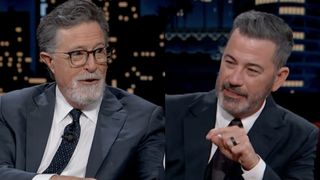 Stephen Colbert, sporting a goatee and fresh light grey suit, seated next to Jimmy Kimmel, also bearded and wearing a suit, on a September appearance on Jimmy Kimmel Live!