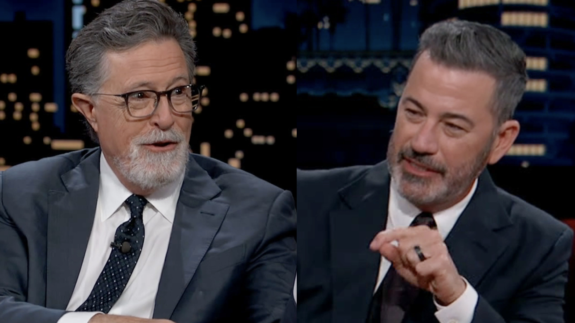 Stephen Colbert, sporting a goatee and fresh light grey suit, seated next to Jimmy Kimmel, also bearded and wearing a suit, on a September appearance on Jimmy Kimmel Live!