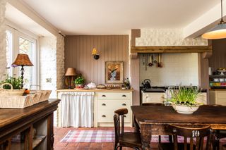 farmhouse country style kitchen with dining table and window