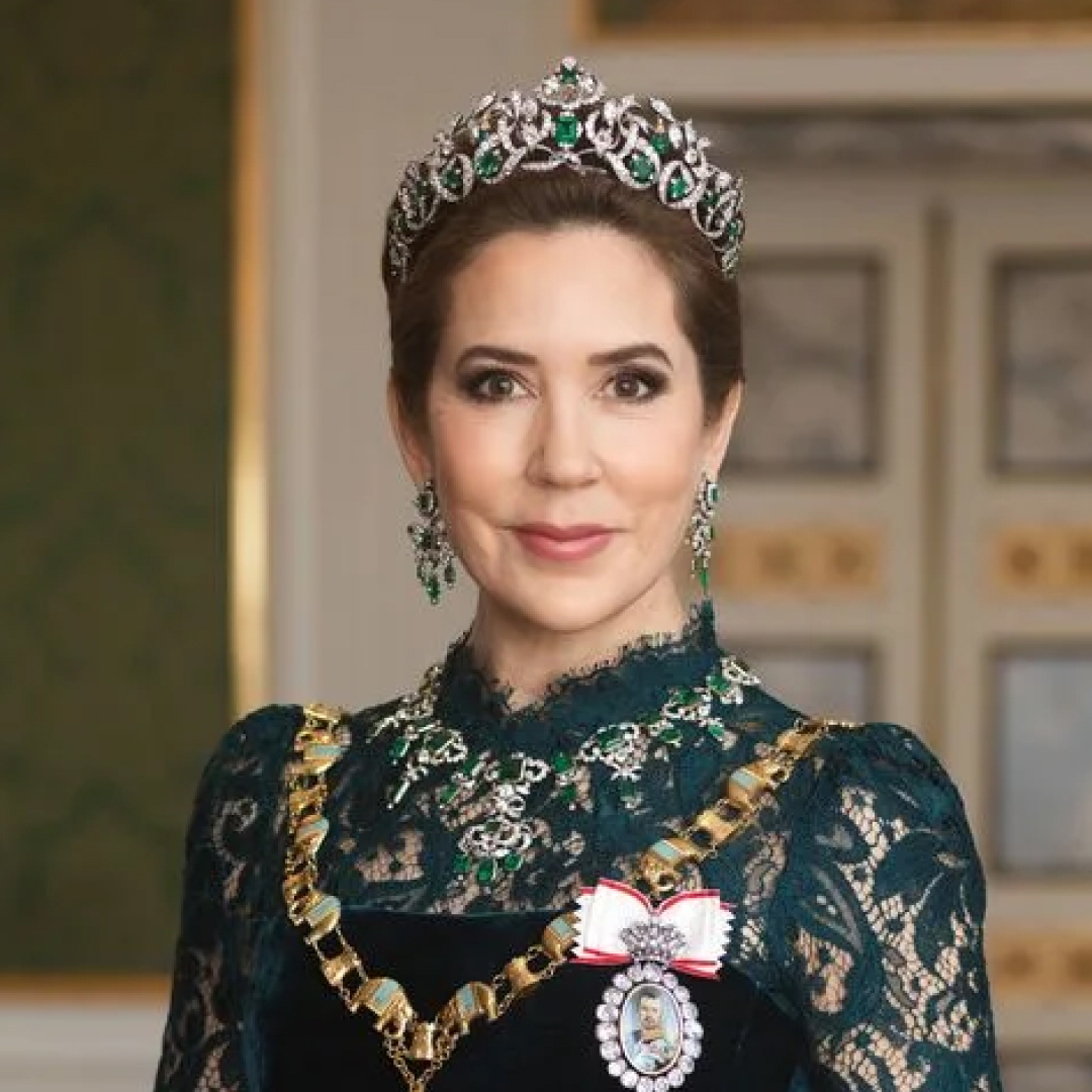 Queen Mary wearing a tiara and green lace dress