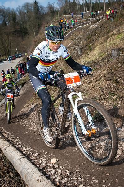 Sabine Spitz climbs up some singletrack