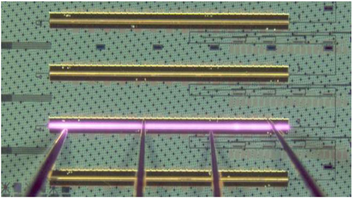 A new trick for merging lasers with silicon could finally make photonic chips cheap, fast, and ready for mass production