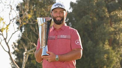 Jon Rahm with the trophy after his win in the 2023 Genesis Invitational