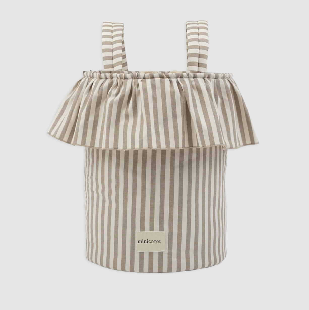 a striped minicoton stroller bg in front of a plain backdrop