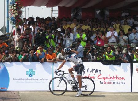 Winner JJ Haedo celebrating his victory in the Mumbai Cyclothon for photographers and tv cameras from Indian national television who broadcasted the race live.