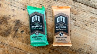 Two OTE Anytime Protein Bars in packets on table