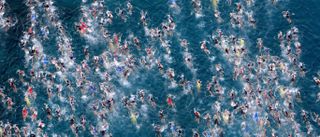 Ironman swimmers compete for space in the pack