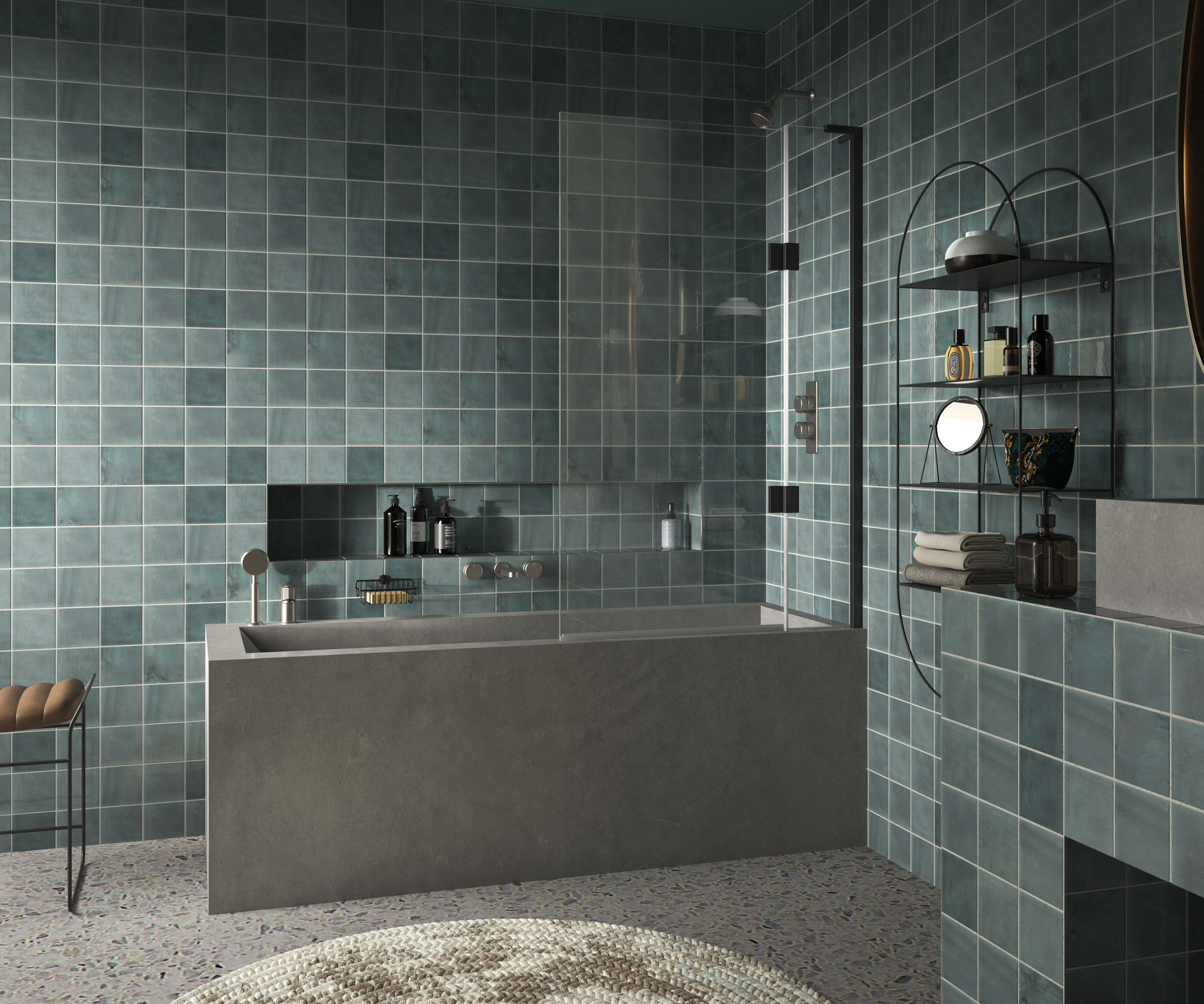 Dark bathroom idea with stone bathtub and basin and green tiles