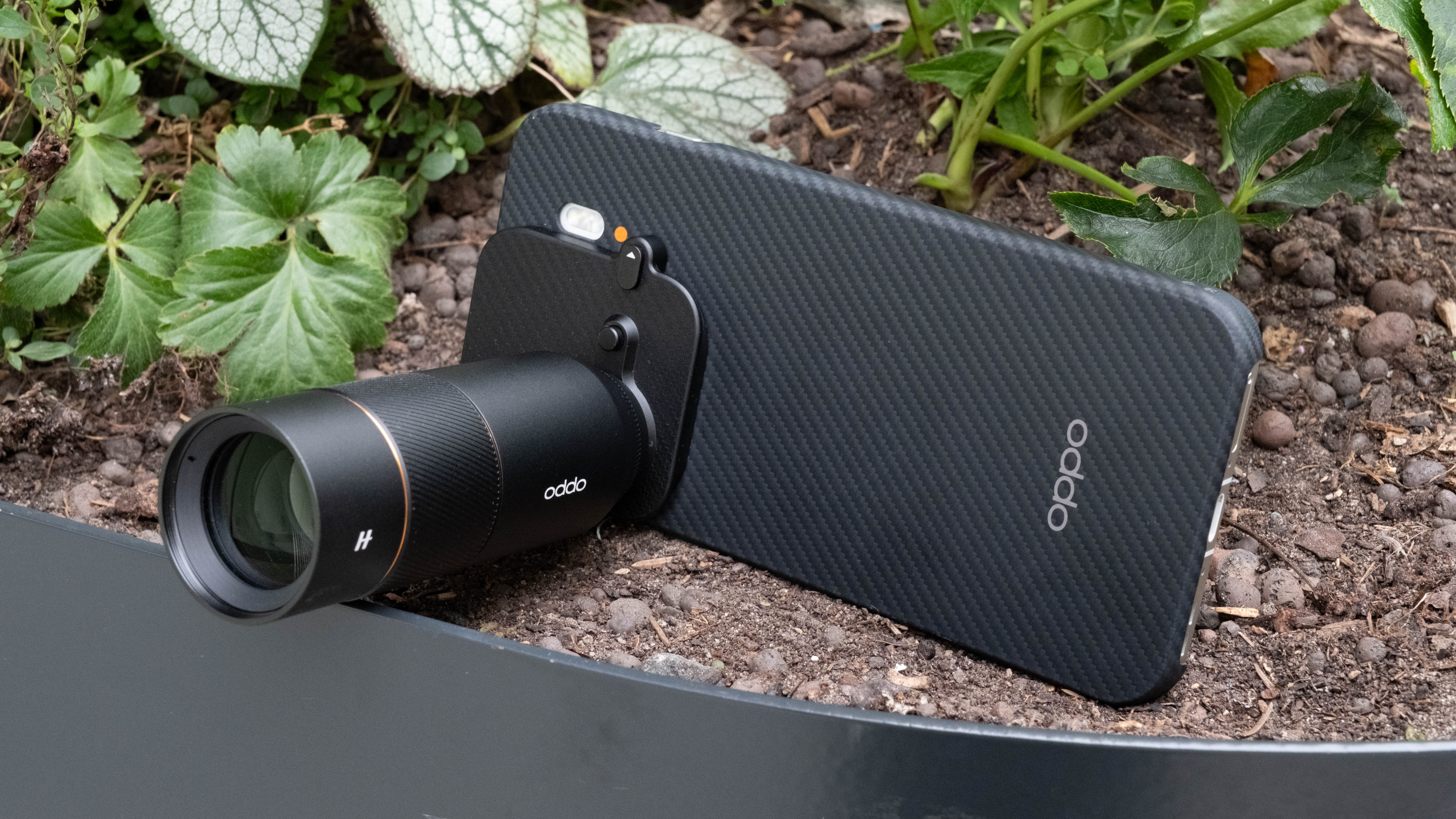 Oppo Find X8 Pro phone with Hasselblad teleconverter attached