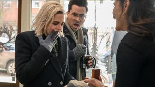 Kristen Stewart looking at engagement ring with Dan Levy in Happiest Season