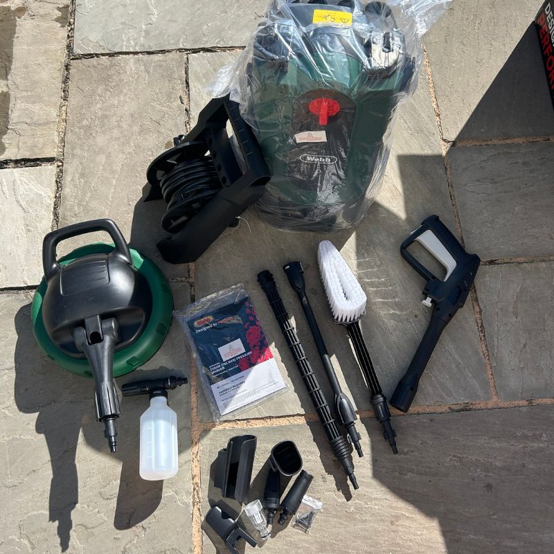 Webb WEPW2200 165 Bar Pressure Washer parts laying on patio