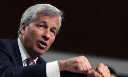 JPMorgan Chase chief Jamie Dimon says the bank's board will review every single person involved in the company's $2 billion trading loss.