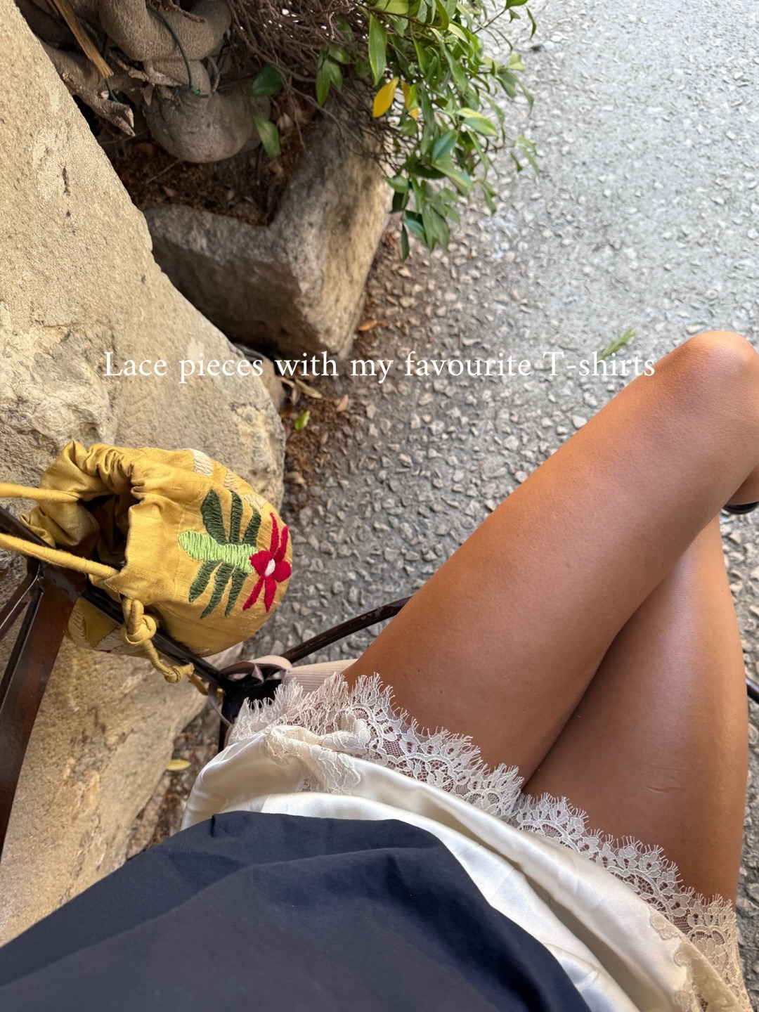 Woman in a tee and lace-trim shorts.