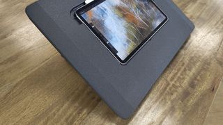 Darkboard iPad drawing stand; a black iPad stand on a wooden table