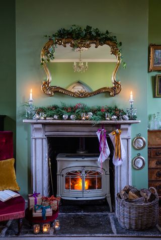 fireplace with stove and mantelpiece decorated for Christmas