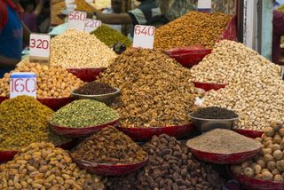 Bins filled with dried fruit and nuts at Chandni Chowk in Delhi, India