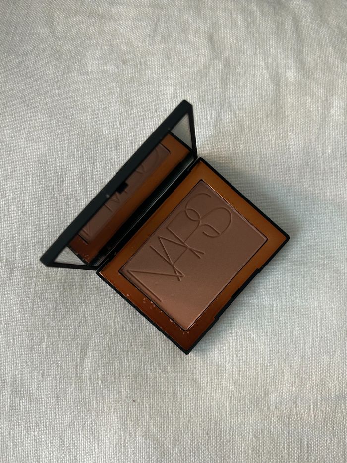 Nars Laguna Bronzer on a white linen background
