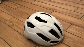 kask sintesi helmet in white on a wooden floor