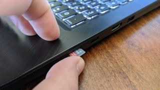 Nintendo Switch microSD card getting inserted in computer.