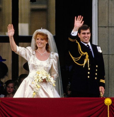 Sarah Ferguson and Prince Andrew waving on their wedding day from Buckingham Palace